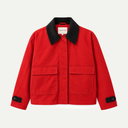 A red utility jacket with a contrasting black corduroy collar, black buttoned cuffs, and two front flap pockets, shown flat on a light off-white background.
